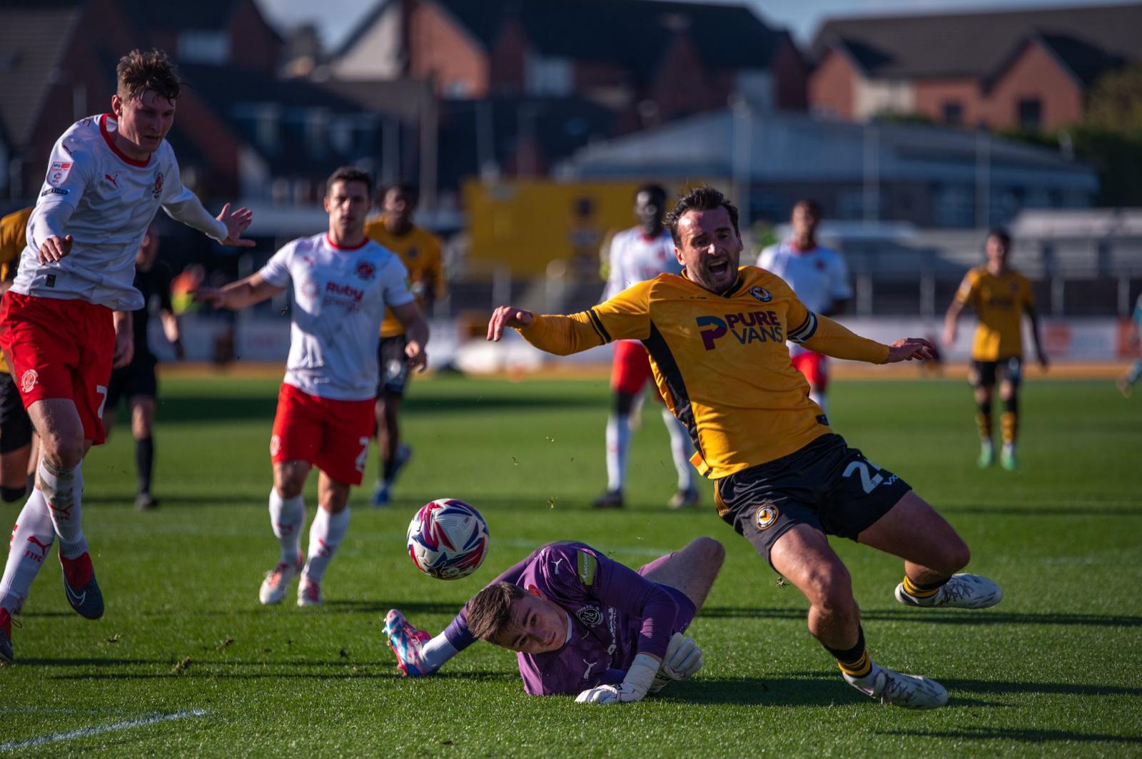 Aaron wildig wins a penalty for Newport County