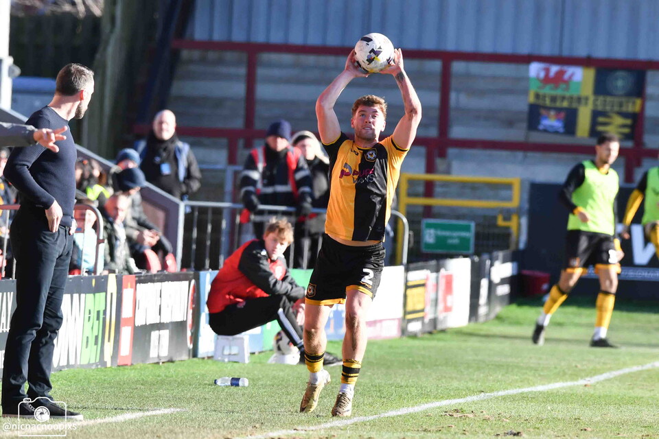 Newport County player taking a throw-in