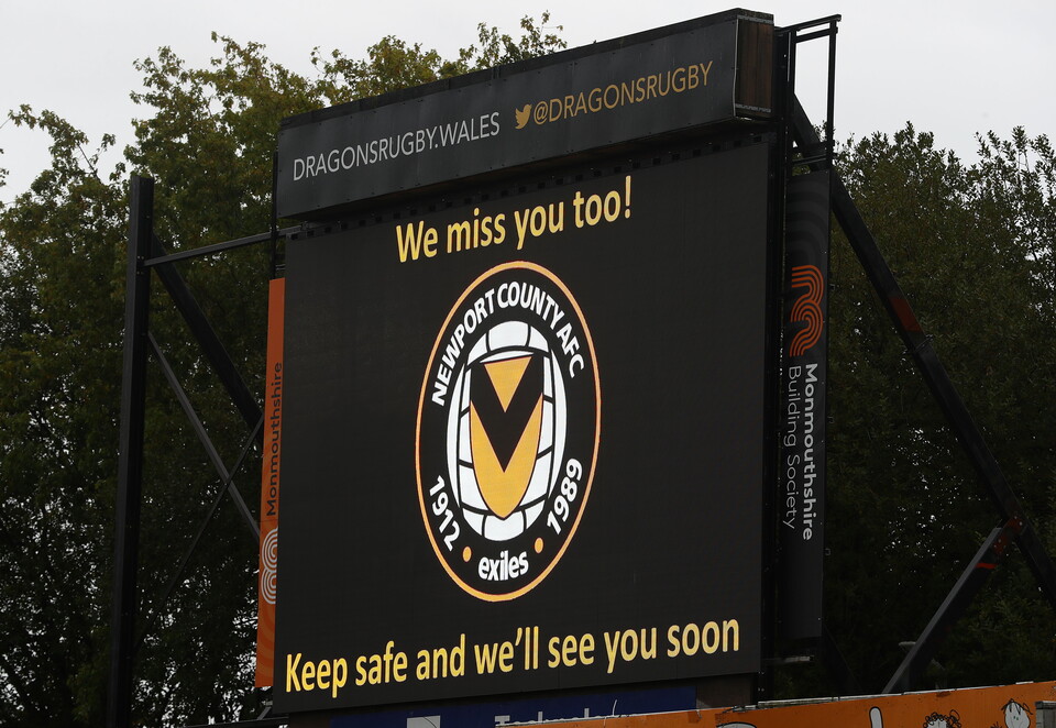 Image of scoreboard at Rodney Parade with 'We miss you too! Keep safe and we'll see you soon' written.
