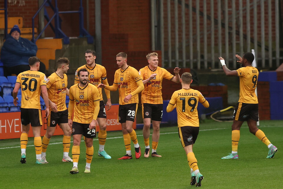 Will Evans of Newport County celebrates scoring the first goal with team mates to make the score 0-1