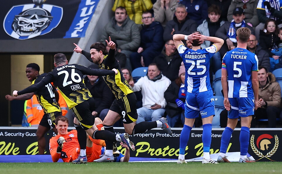 Cole Stockton of Salford City celebrates scoring the opening goal