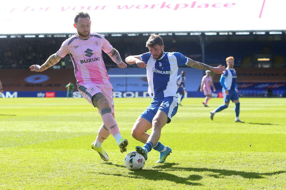 Gethin Jones of Milton Keynes Dons and Jamie Robson of Oldham